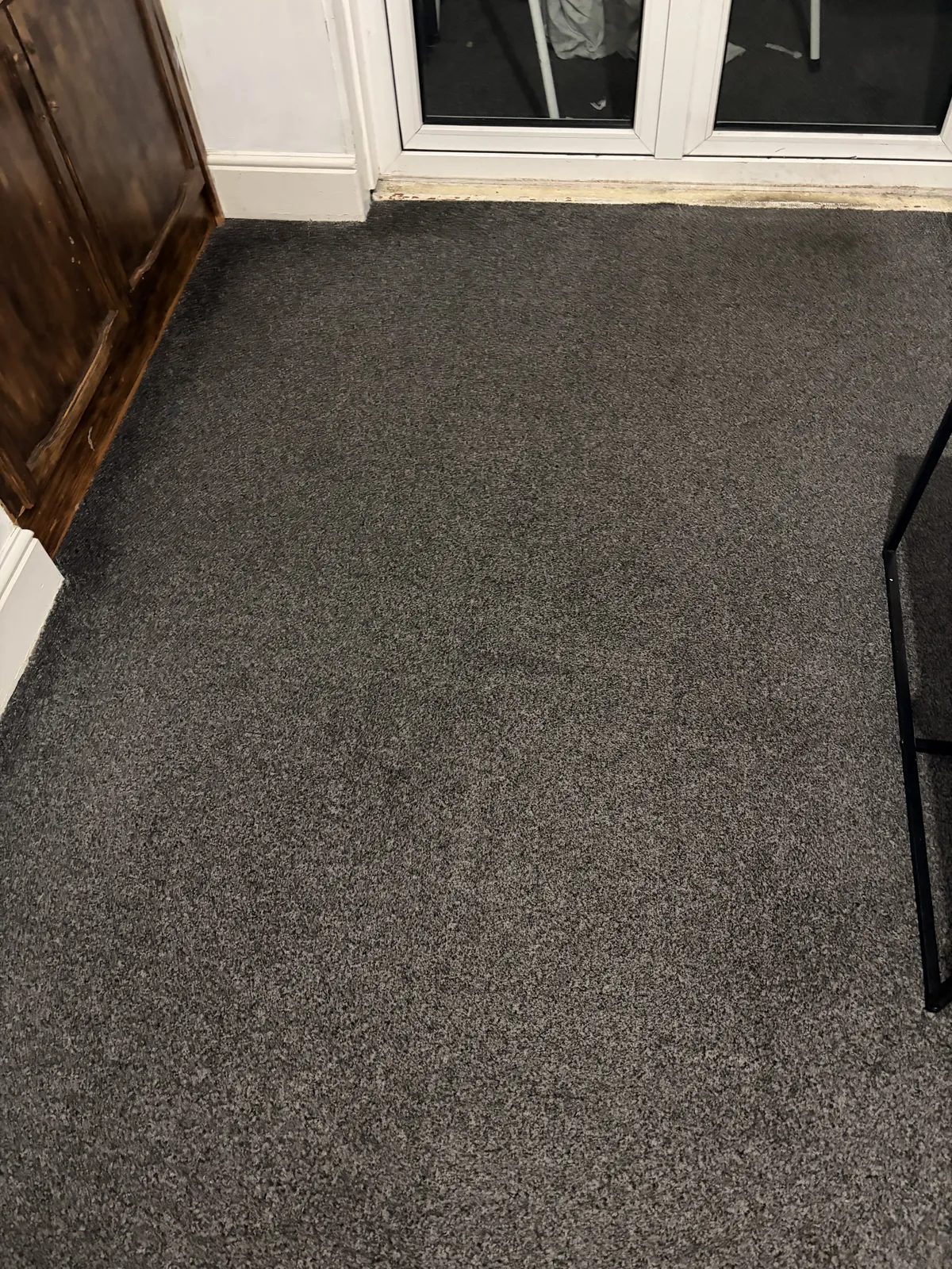 Home 13 Grey fitted carpet beside patio doors in a customer's home